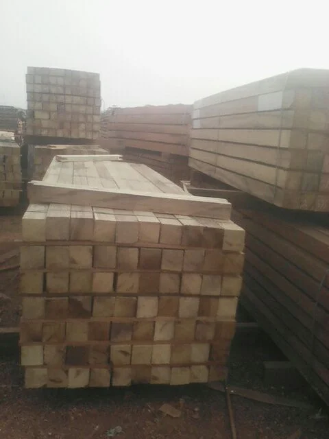 Neatly stacked air dried Iroko lumber at sawmill staging area