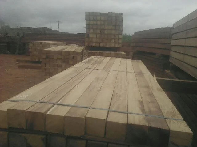 Precision-cut Iroko sawn lumber stacked at open-air drying yard
